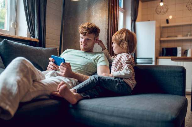 istock Dad and son spending weekend together and looking peaceful 1435061882