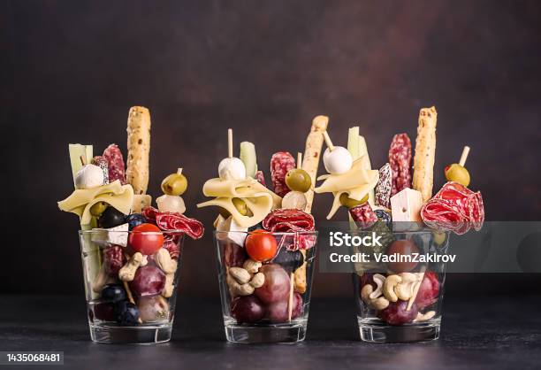 Jarcuterie In A Glass The Modern Version Of Charcuterie Includes Various Types Of Sausages Pickles And Cheese Stock Photo - Download Image Now