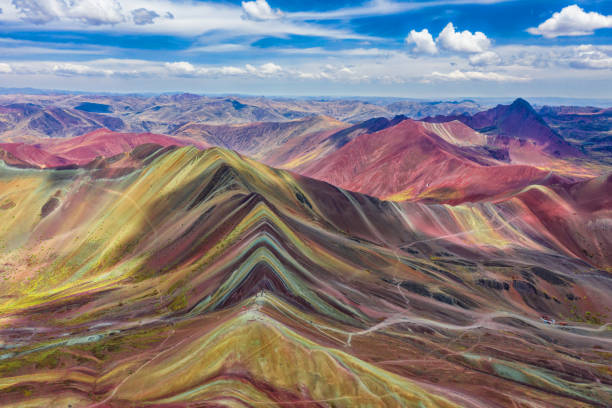 Aerial view of the entire Rainbow Mountains in Peru with Vinicunca in the center and the Red Valley in the background. stock photo