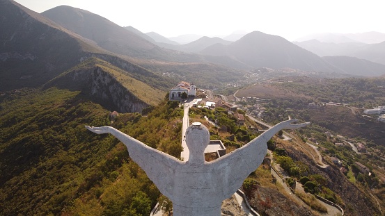 An aerial view of Statue of Christ the Redeemer in Maratea, Italy