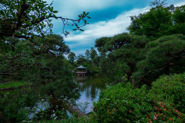 istock Pond with trees and pergola in the background. 1435070889