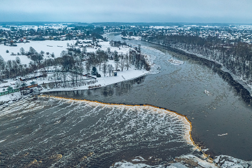 Winter landscape. Aerial view of Venta Rapid (Ventas rumba), waterfall on the Venta River in Kuldiga, Latvia. Widest waterfall in Europe.
