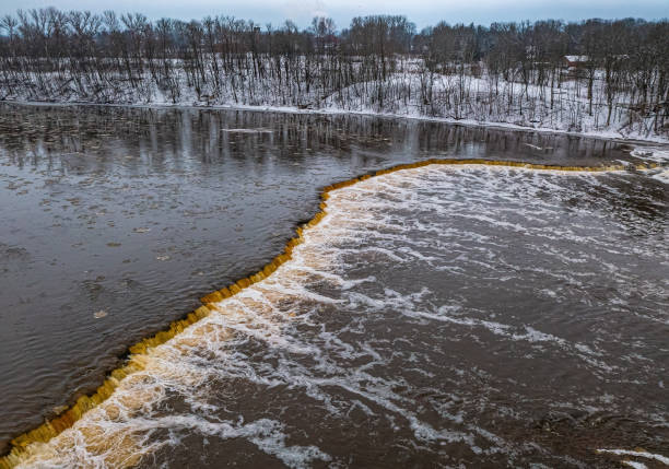 Winter landscape. Venta Rapid (Ventas rumba), waterfall on the Venta River in Kuldiga, Latvia. Widest waterfall in Europe.