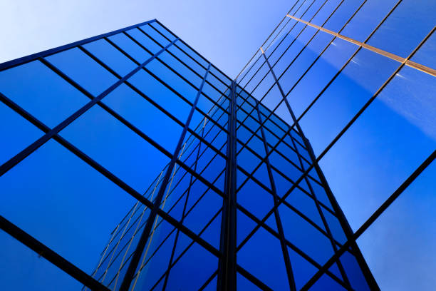 istock Business Building with Glass Windows Reflecting Blue Sky 1435073332