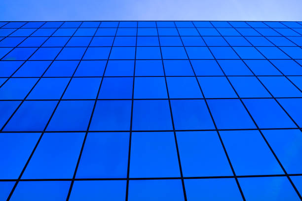 istock Business Building with Glass Windows Reflecting Blue Sky 1435073337