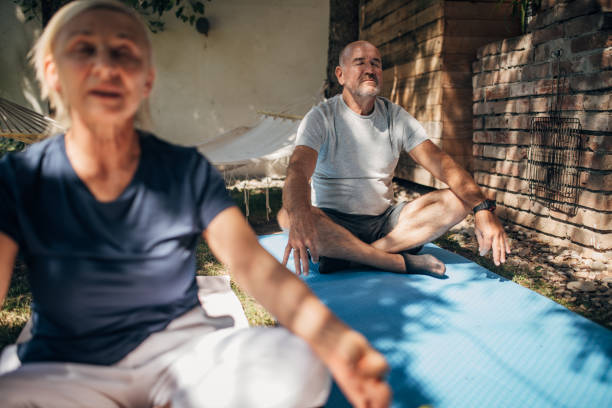 istock Senior couple meditating 1435074244