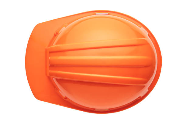 Orange plastic hard hat stock photo