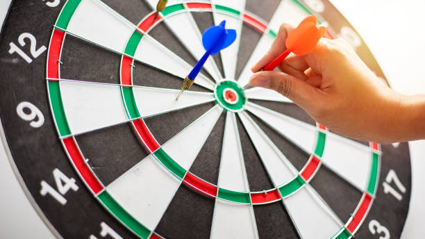 istock Hand business put a dart hit on the target,Goal target concept 1435076621