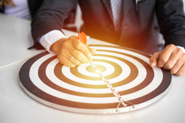 istock Hand business put a dart hit on the target,Goal target concept 1435076686