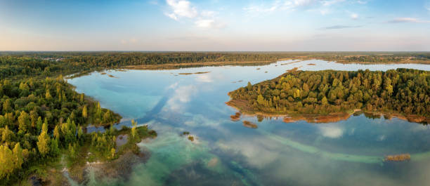 istock Blue lake with bright blue water and clouds reflection aerial panoramic view 1435077098
