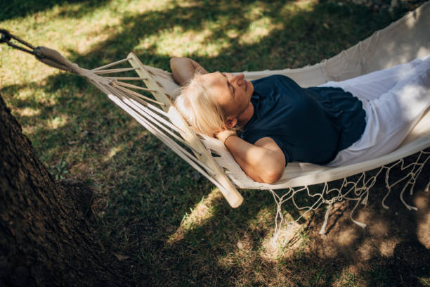 istock Woman relaxing in hammock 1435078197