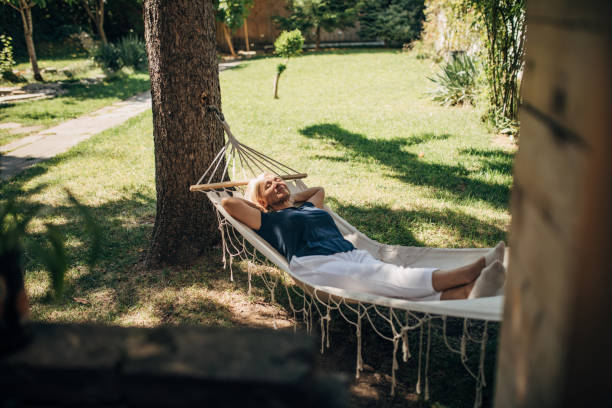 istock Woman relaxing in hammock 1435078209