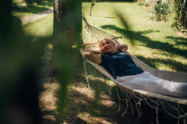 istock Woman relaxing in hammock 1435078244