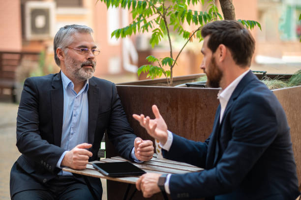 istock Two business partners having a conversation on an informal meeting 1435078555