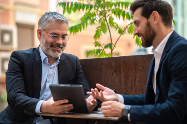 istock Business partners discussing project details and looking involved 1435078556