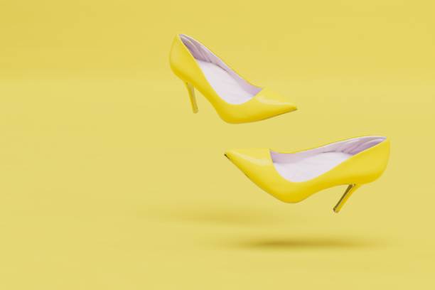 istock Beautiful women's shoes with yellow heels on a yellow background. copy paste, copy space. 3D render 1435078772