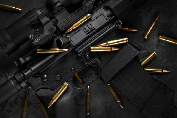 AR15 rifle with cartridges, flat lay composition AR15 rifle with cartridges, dark flat lay composition carbine stock pictures, royalty-free photos & images