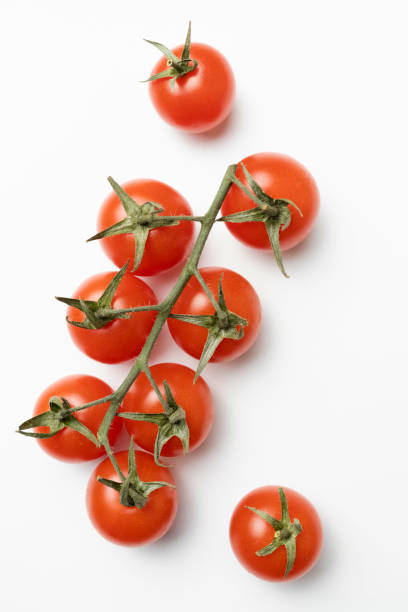 istock Bunch of fresh, red tomatoes isolated on white background 1435079893