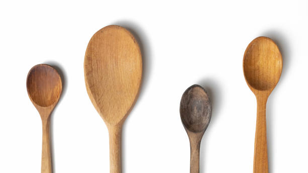 istock Wooden kitchen spoons isolated on white background 1435079904
