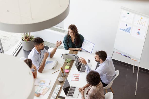istock Coworkers brainstorming, planning in a meeting 1435080164