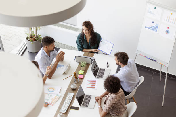 istock Coworkers brainstorming, planning in a meeting 1435080384