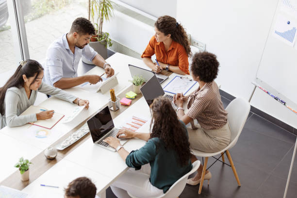 istock Coworkers brainstorming, planning in a meeting 1435080426