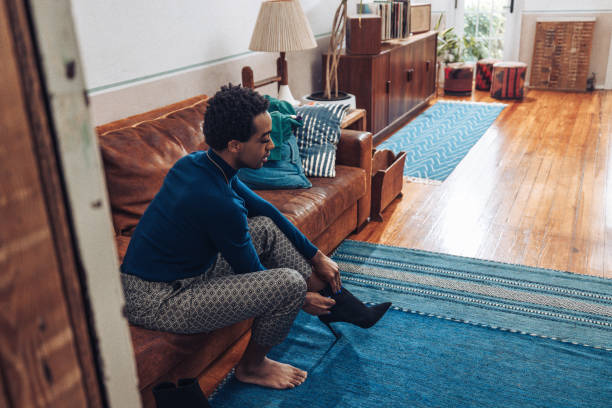 istock Non-binary person getting dressed and He/She is wearing high heels 1435080467
