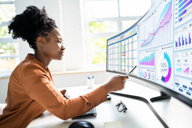 Analyst Woman Looking Analyst Woman Looking At Business Data Analytics Dashboard analysing stock pictures, royalty-free photos & images