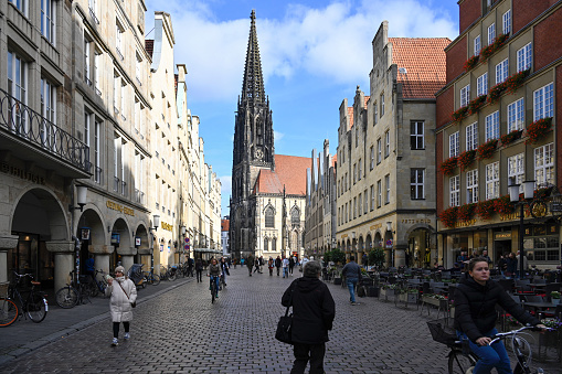 Münster, Germany, October 19, 2022 - Prinzipalmarkt with Lambertikirche in Münster, Westphalia, Germany