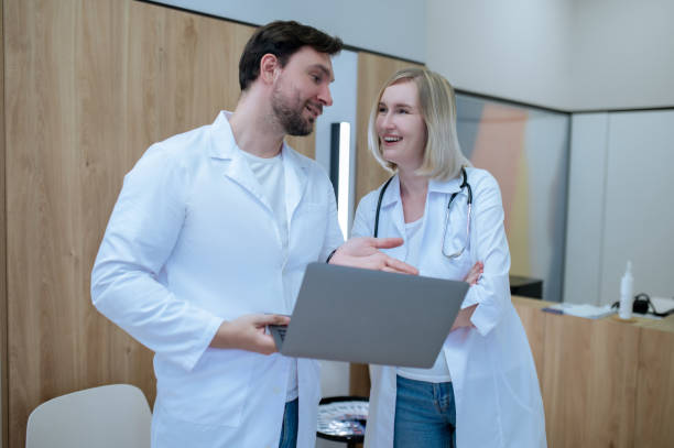 istock Clinic doctors communicating in the reception area 1435082104