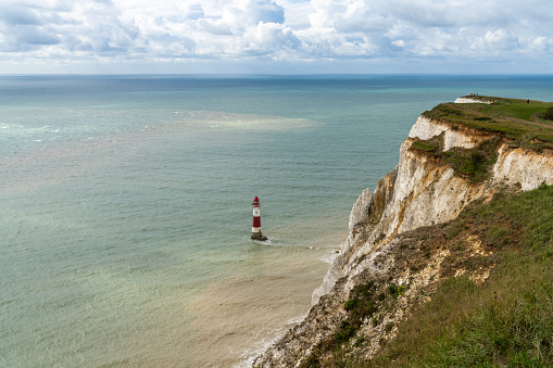View of the Beachy Head Lighthouse in the English Channel and the white cliffs of the Jurassic Coast
