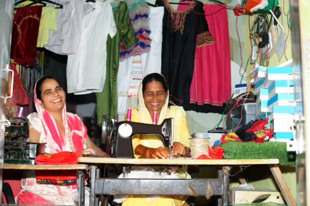istock Female tailor stitching clothes portrait together 1435083978