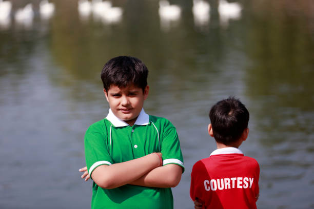 Elementary student enjoying summer vacation near lakeside.
