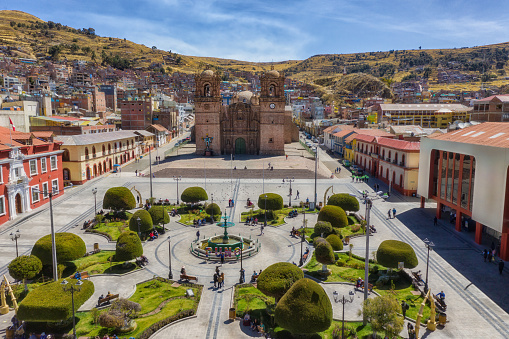 Aerial view of Plaza de Armas in Puno on Lake Titicaca in Peru, after the conversion of the monument to Francisco Bolognesi for an old French fountain from the end of the 19th century.