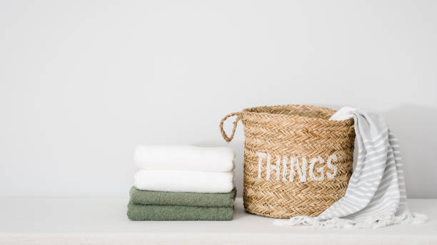 istock clean terry towels and dirty sheet in wicker basket 1435088569