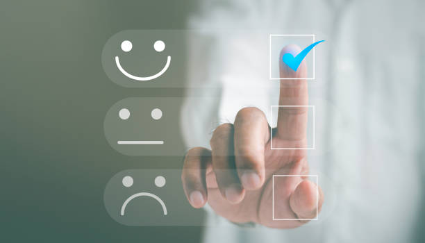 istock Satisfaction and customer service concept, Business man touching the virtual screen on the happy Smile face icon to give satisfaction in service. rating very impressed. 1435089100