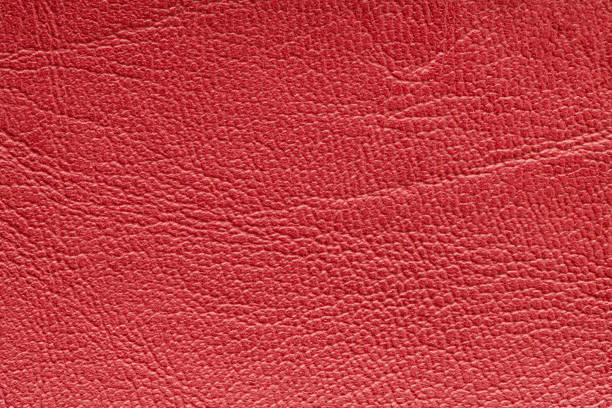 istock Red artificial or synthetic leather background with neat texture and copy space 1435089501