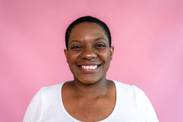 istock Portrait of a mature woman on a pink background 1435089607