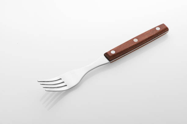 Wooden fork isolated on white background. Studio shot.