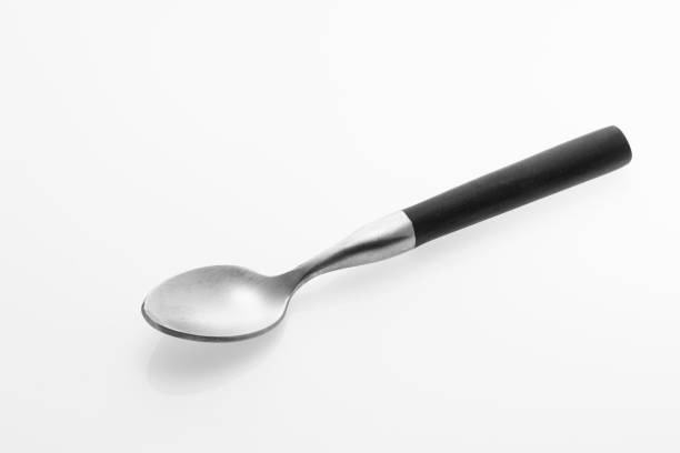 istock Wooden silver spoon isolated on white background. 1435091425