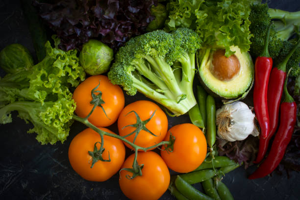 istock Fresh vegetables and fruits on a dark background 1435091947