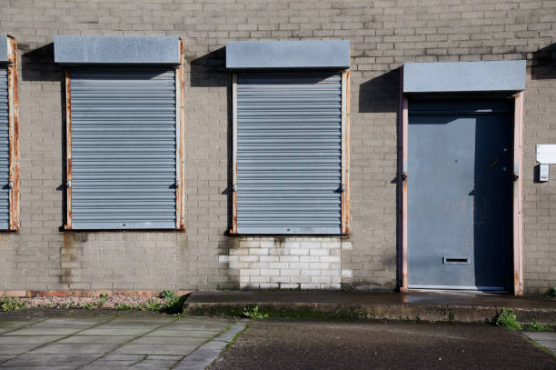 istock Office window shutters closed due to business closure 1435096965