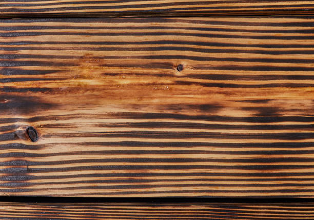 burned, old wood texture. wall textured background pattern.