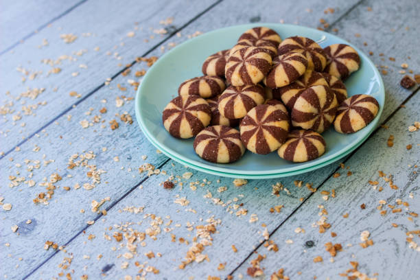 Sweet chocolate brownies on rustic wooden table with flakes