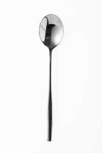 Silver spoon isolated on white background. Studio shot.
