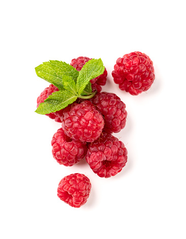 Juicy forest raspberry with mint leaf on a white isolated background. Healthy food concept. Top view