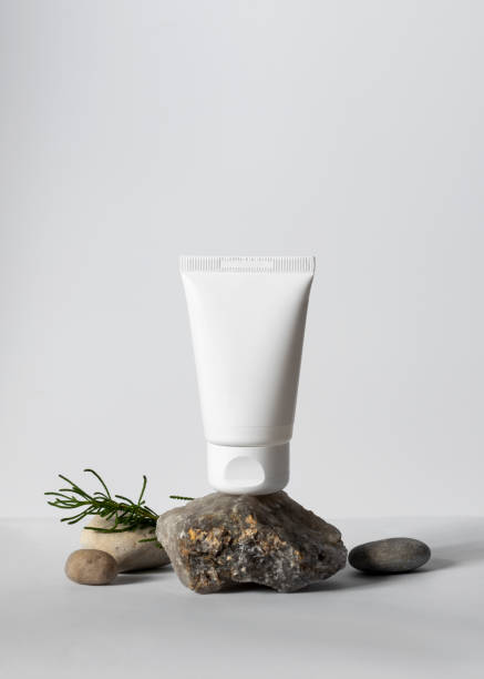 istock White cream pipe mockup on stone with natural materials around 1435099042