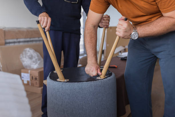 istock Men adjusting new chairs at home 1435099526