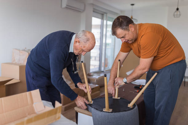 istock Men adjusting new chairs at home 1435100145
