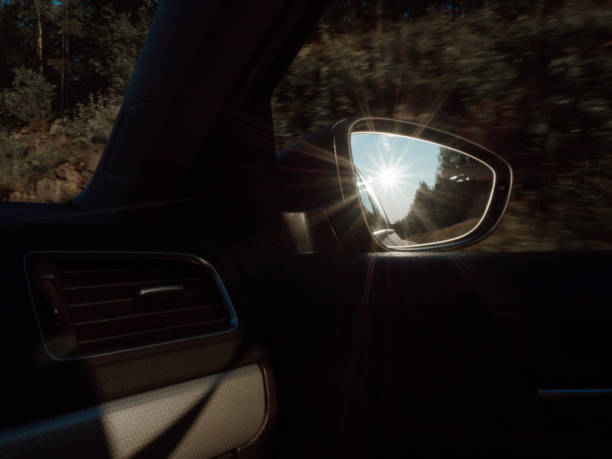 istock Car mirror or side rear view mirror with reflection of beautiful sunset 1435102605